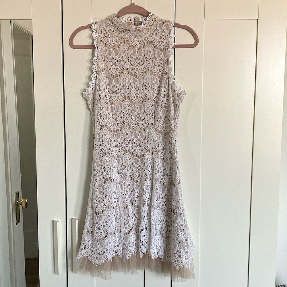 Francesca’s lace white dress with nude lining. Size M